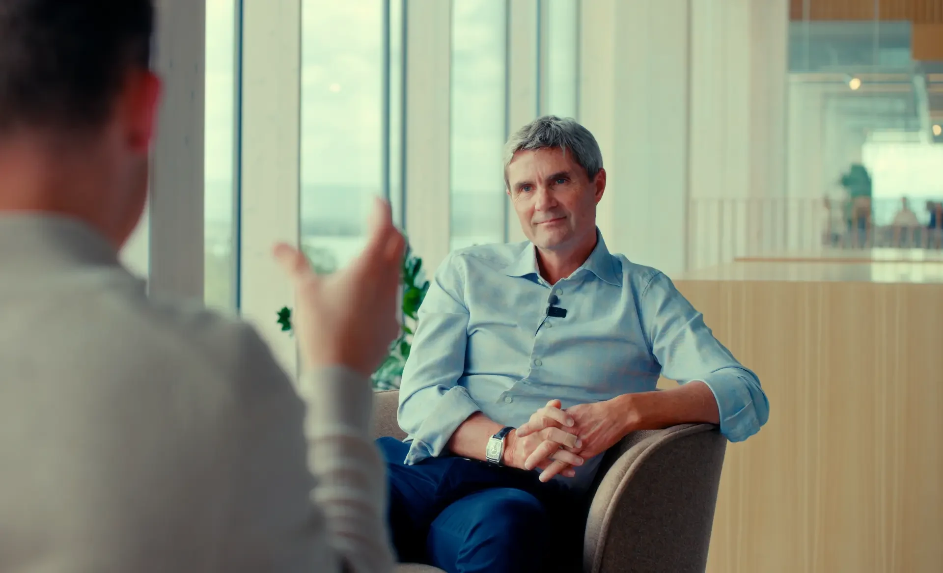 Interview film still of an executive in an Oslo office